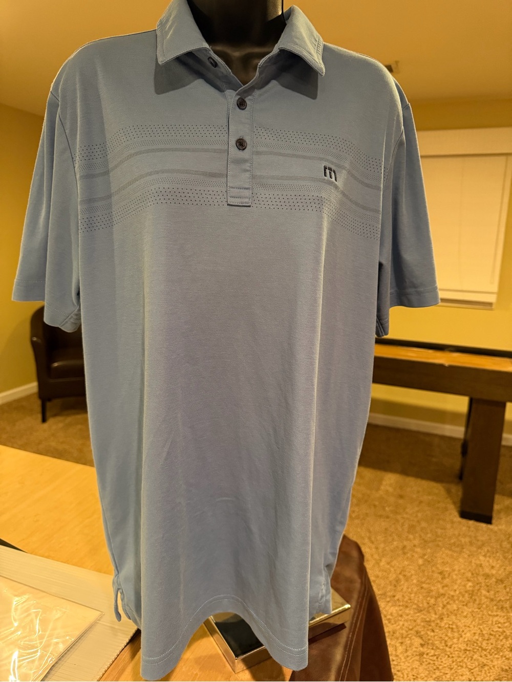 Travis Matthew Light Blue Men's Polo Shirt with Subtle Stripe and Mesh Detail